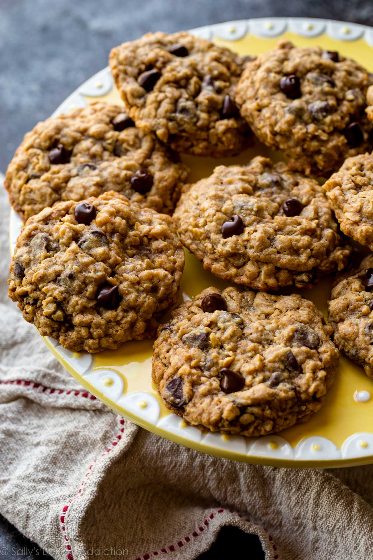 oatmeal chocolate chip cookies on a yellow and white plate